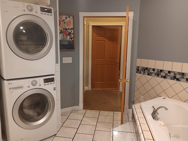 232 2nd St NW, Menahga, MN 56464 - laundry area featuring stacked washer / dryer and baseboards