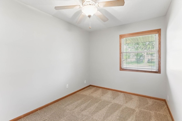11001 Quincy Blvd NE, Blaine, MN 55434 - unfurnished room with light colored carpet, baseboards, and ceiling fan