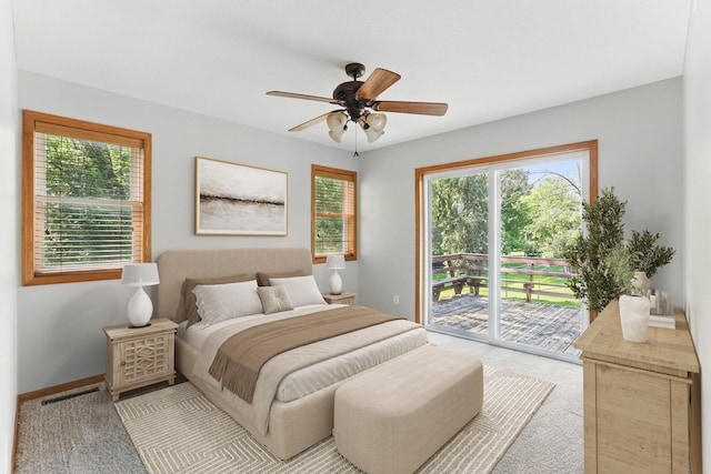 11001 Quincy Blvd NE, Blaine, MN 55434 - bedroom featuring access to exterior, multiple windows, carpet, and a ceiling fan