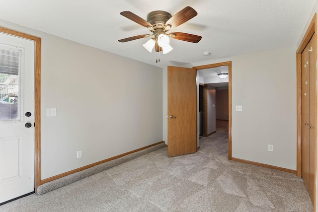 11001 Quincy Blvd NE, Blaine, MN 55434 - unfurnished room with light carpet, baseboards, a ceiling fan, and a smoke detector