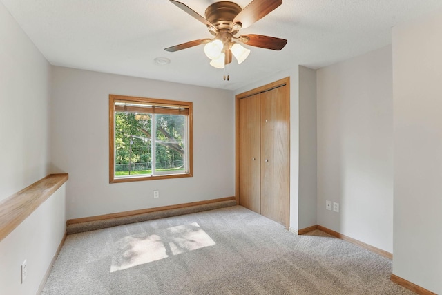 11001 Quincy Blvd NE, Blaine, MN 55434 - unfurnished bedroom with carpet, a closet, ceiling fan, and baseboards