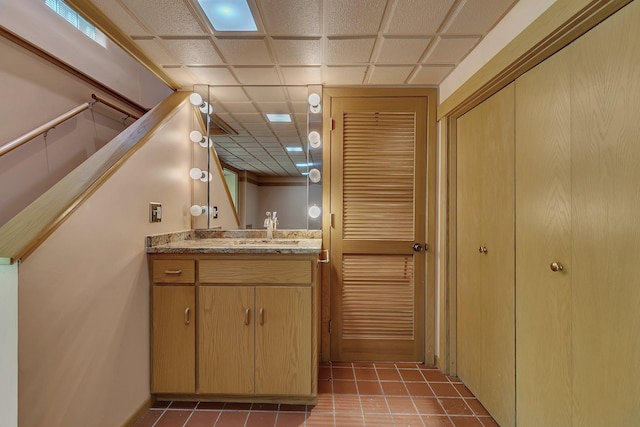398 Riverside Ave S, Sartell, MN 56377 - bathroom with vanity, tile patterned floors, and a paneled ceiling