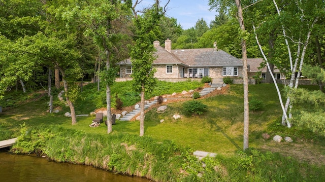 8821 Interlachen Rd, Lake Shore, MN 56468 - view of front of property with a chimney, a front yard, stairway, and stone siding