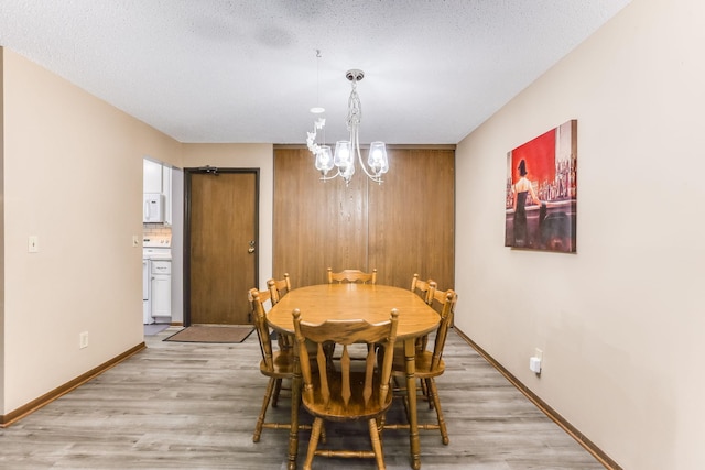 1855 Silver Bell Rd Unit 120, Eagan, MN 55122 - dining space featuring a chandelier and light wood-type flooring