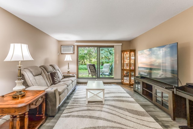 1855 Silver Bell Rd Unit 120, Eagan, MN 55122 - living room featuring a wall unit AC and wood finished floors