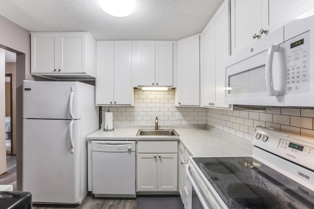 1855 Silver Bell Rd Unit 120, Eagan, MN 55122 - kitchen with white appliances, white cabinetry, light countertops, a textured ceiling, and tasteful backsplash