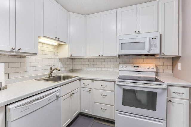 1855 Silver Bell Rd Unit 120, Eagan, MN 55122 - kitchen featuring white appliances, light countertops, white cabinets, and tasteful backsplash