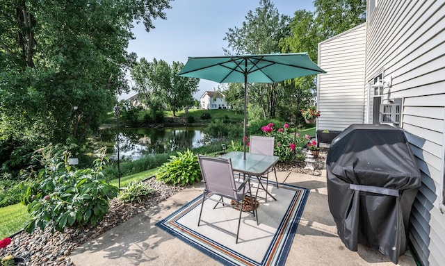 15608 Fjord Ave, Apple Valley, MN 55124 - view of patio / terrace with outdoor dining area, a water view, and a grill