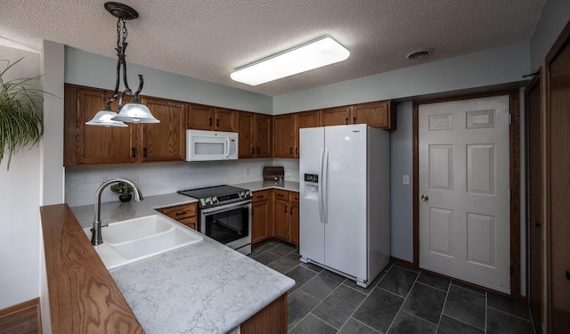 15608 Fjord Ave, Apple Valley, MN 55124 - kitchen with white appliances, a sink, backsplash, a textured ceiling, and light countertops