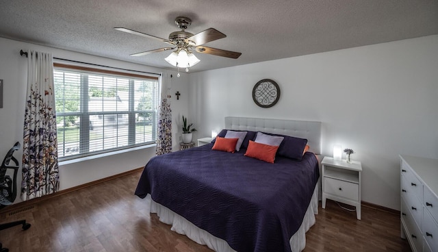 15608 Fjord Ave, Apple Valley, MN 55124 - bedroom with baseboards, wood finished floors, a textured ceiling, and ceiling fan
