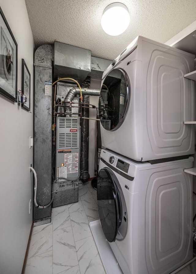 15608 Fjord Ave, Apple Valley, MN 55124 - laundry room with stacked washing machine and dryer, marble finish floors, and a textured ceiling
