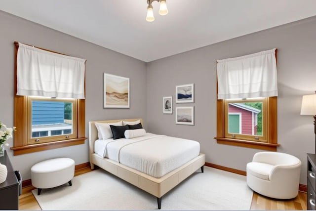 145 Robie St W, Saint Paul, MN 55107 - bedroom with wood finished floors and baseboards