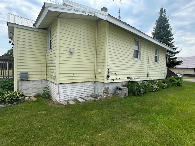 207 Cook St, Palisade, MN 56469 - view of side of home with a lawn and a metal roof