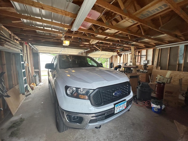 207 Cook St, Palisade, MN 56469 - garage featuring a garage door opener