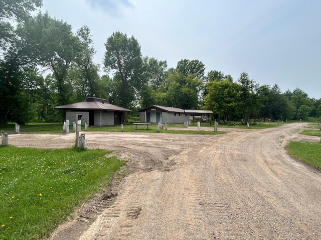 207 Cook St, Palisade, MN 56469 - view of front facade featuring curved driveway and view of wooded area