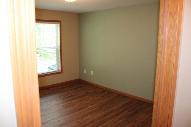 14257 184th Ave NW, Elk River, MN 55330 - empty room featuring dark wood-style flooring and baseboards