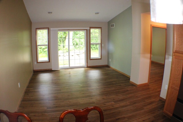 14257 184th Ave NW, Elk River, MN 55330 - unfurnished living room with vaulted ceiling, dark wood finished floors, and baseboards