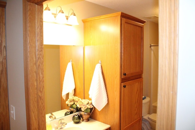 14257 184th Ave NW, Elk River, MN 55330 - bathroom featuring toilet and vanity