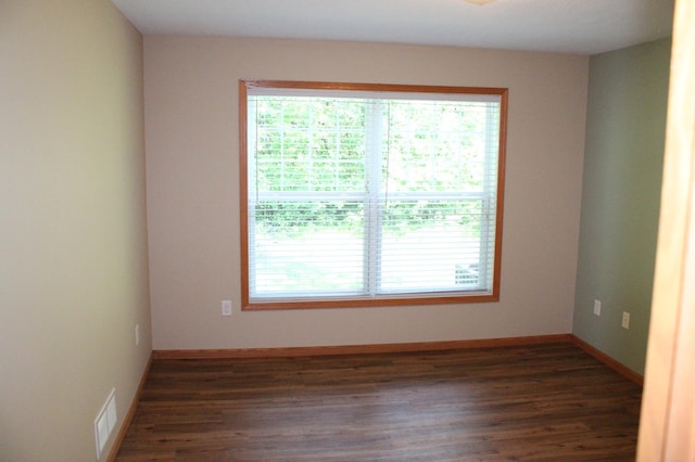 14257 184th Ave NW, Elk River, MN 55330 - unfurnished room featuring dark wood-style flooring and baseboards