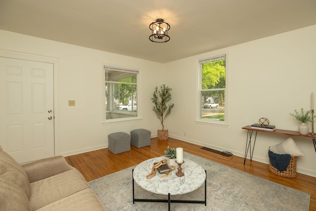 1126 7th Ave SE, Rochester, MN 55904 - living area with wood finished floors, healthy amount of natural light, and a chandelier