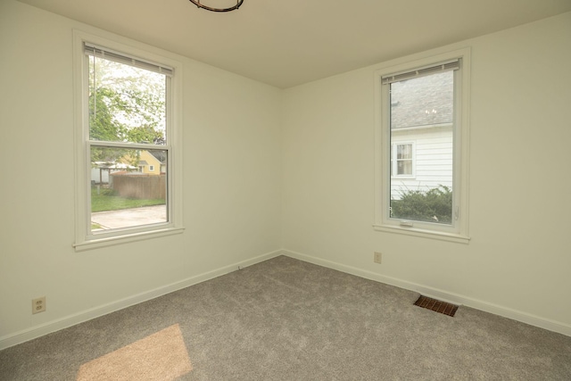 1126 7th Ave SE, Rochester, MN 55904 - spare room with carpet and baseboards