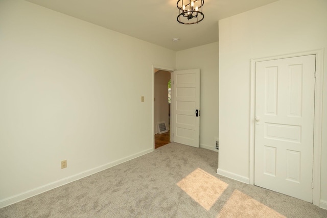 1126 7th Ave SE, Rochester, MN 55904 - unfurnished bedroom with carpet and a chandelier