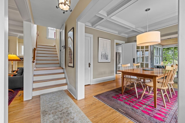 4817 Emerson Ave S, Minneapolis, MN 55419 - dining area featuring light wood-style flooring, stairway, coffered ceiling, beam ceiling, and crown molding