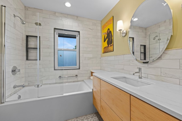 4817 Emerson Ave S, Minneapolis, MN 55419 - bathroom with tile walls, vanity, and combined bath / shower with glass door