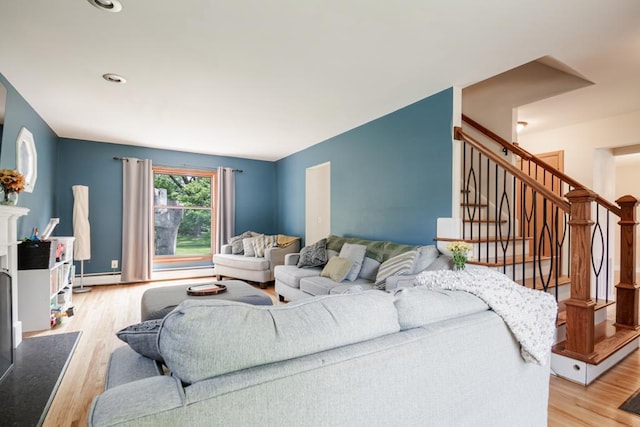 569 Driftwood Rd, New Brighton, MN 55112 - living area featuring light wood finished floors, stairway, a baseboard heating unit, and recessed lighting