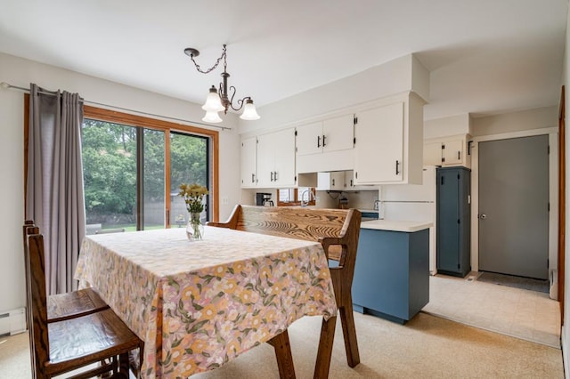 569 Driftwood Rd, New Brighton, MN 55112 - dining space featuring a chandelier, light colored carpet, and a baseboard heating unit