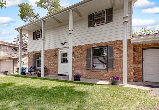 569 Driftwood Rd, New Brighton, MN 55112 - back of house featuring brick siding, a lawn, and an attached garage