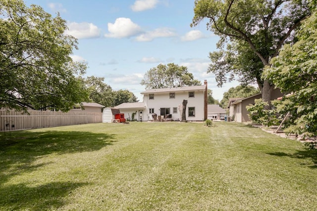 569 Driftwood Rd, New Brighton, MN 55112 - rear view of property with a chimney and cooling unit