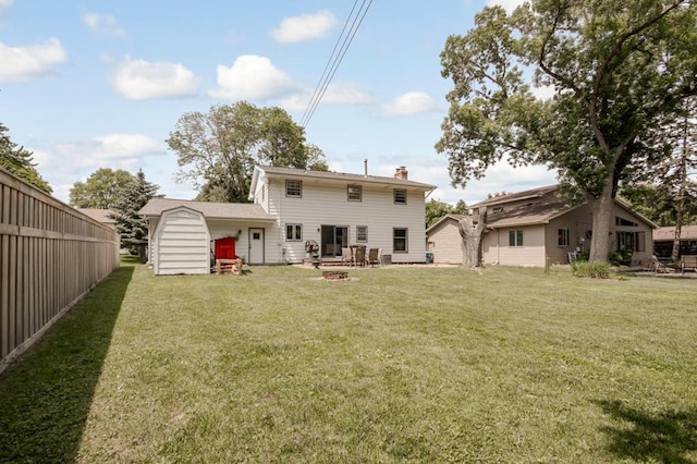569 Driftwood Rd, New Brighton, MN 55112 - rear view of house featuring a yard, a chimney, and a garage