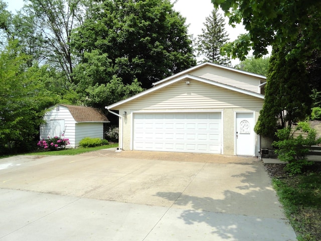9540 24th Ave N, Plymouth, MN 55441 - detached garage featuring a storage unit