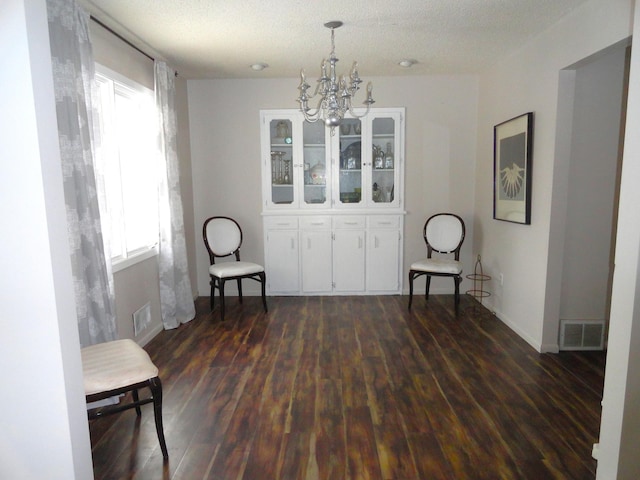 9540 24th Ave N, Plymouth, MN 55441 - sitting room with dark wood-type flooring, a chandelier, plenty of natural light, baseboards, and a textured ceiling