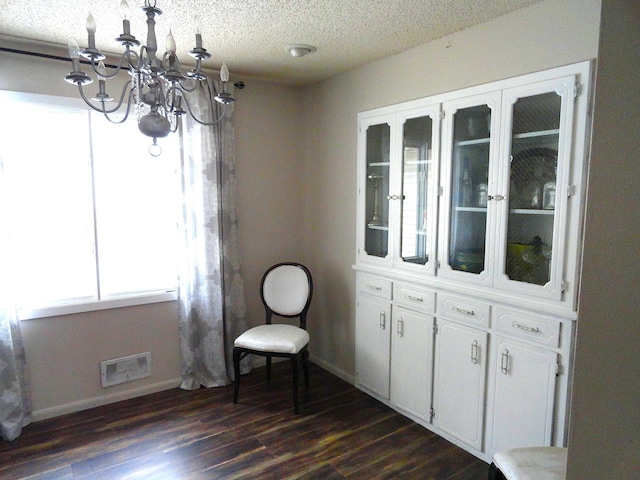 9540 24th Ave N, Plymouth, MN 55441 - sitting room featuring a chandelier, dark wood-type flooring, baseboards, and a textured ceiling