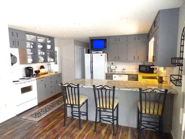 9540 24th Ave N, Plymouth, MN 55441 - kitchen featuring white appliances, gray cabinetry, tasteful backsplash, a peninsula, and recessed lighting