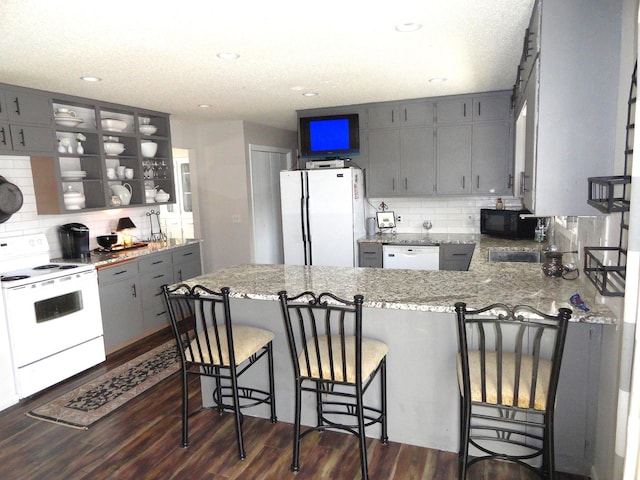 9540 24th Ave N, Plymouth, MN 55441 - kitchen with white appliances, gray cabinets, tasteful backsplash, a peninsula, and recessed lighting
