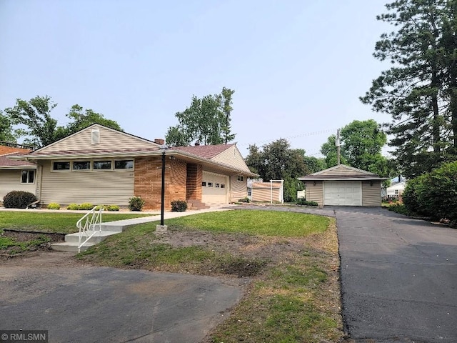 109 Jackson St W, Eagle Bend, MN 56446 - view of side of home with brick siding, a lawn, and an outdoor structure