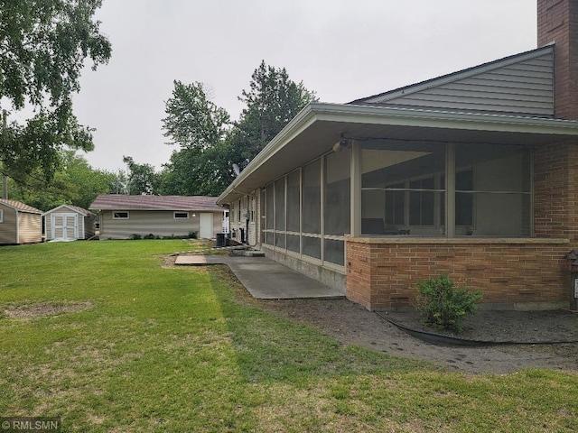 109 Jackson St W, Eagle Bend, MN 56446 - view of grassy yard featuring a sunroom