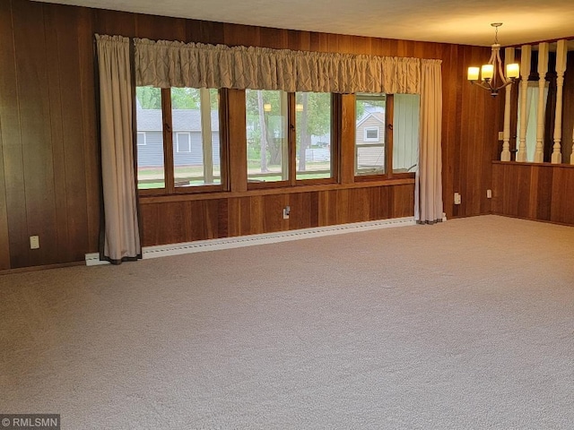 109 Jackson St W, Eagle Bend, MN 56446 - carpeted empty room with wooden walls and a chandelier
