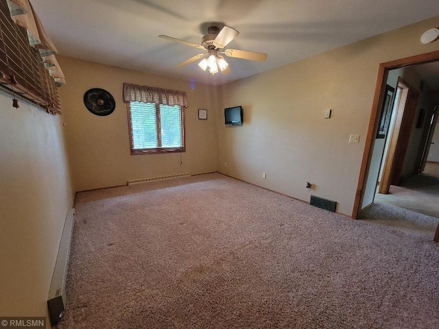 109 Jackson St W, Eagle Bend, MN 56446 - carpeted spare room with a ceiling fan, a baseboard heating unit, and baseboard heating