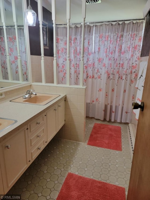 109 Jackson St W, Eagle Bend, MN 56446 - bathroom with double vanity and baseboard heating
