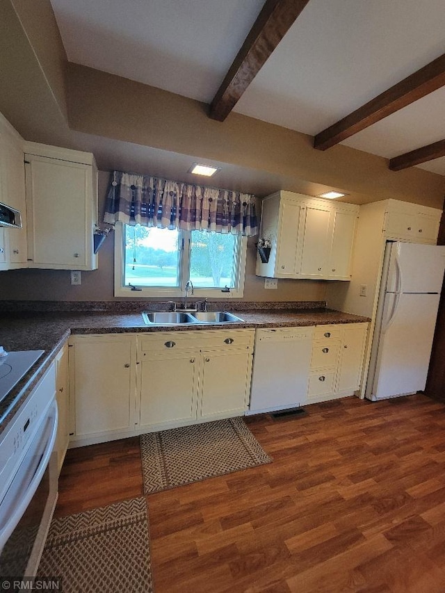109 Jackson St W, Eagle Bend, MN 56446 - kitchen with white appliances, a sink, dark countertops, white cabinetry, and beam ceiling