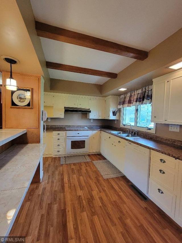 109 Jackson St W, Eagle Bend, MN 56446 - kitchen with white appliances, under cabinet range hood, a sink, beamed ceiling, and wood finished floors