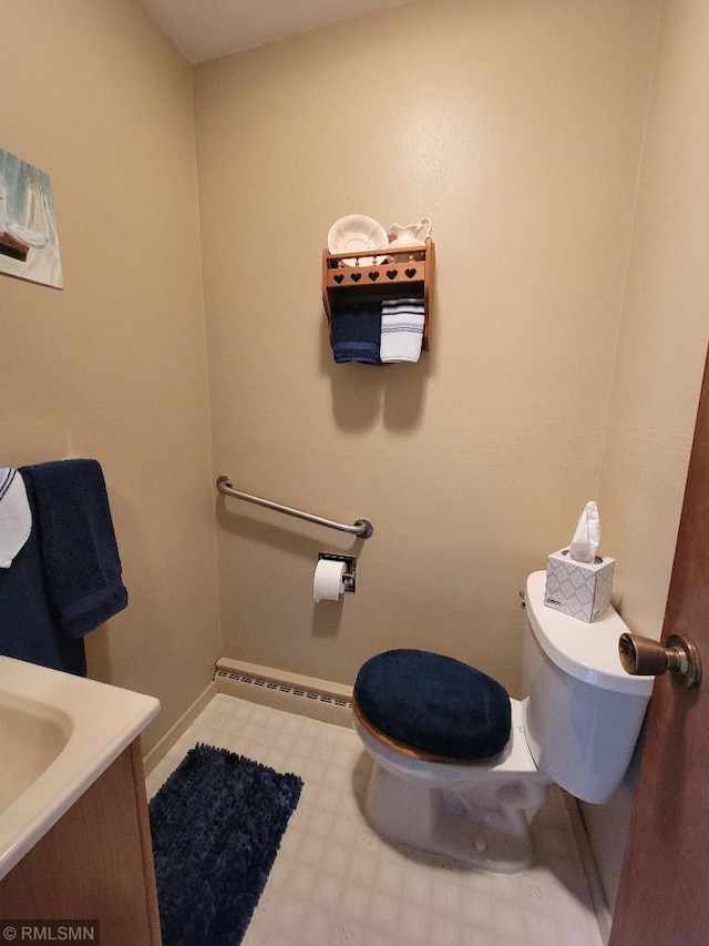 109 Jackson St W, Eagle Bend, MN 56446 - half bathroom with toilet, vanity, and baseboards