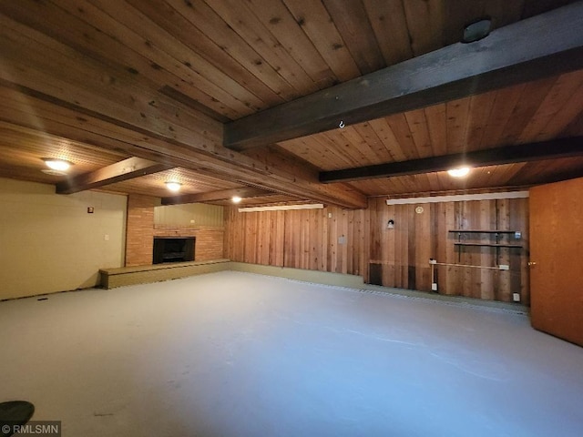 109 Jackson St W, Eagle Bend, MN 56446 - unfurnished living room with a large fireplace, wooden ceiling with exposed beams, concrete floors, and wood walls