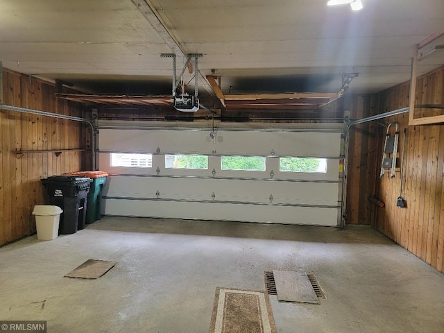 109 Jackson St W, Eagle Bend, MN 56446 - garage featuring wooden walls and a garage door opener
