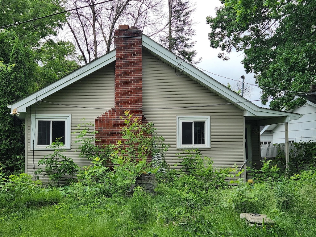220 3rd Ave NW, Forest Lake, MN 55025 - view of home's exterior featuring a chimney