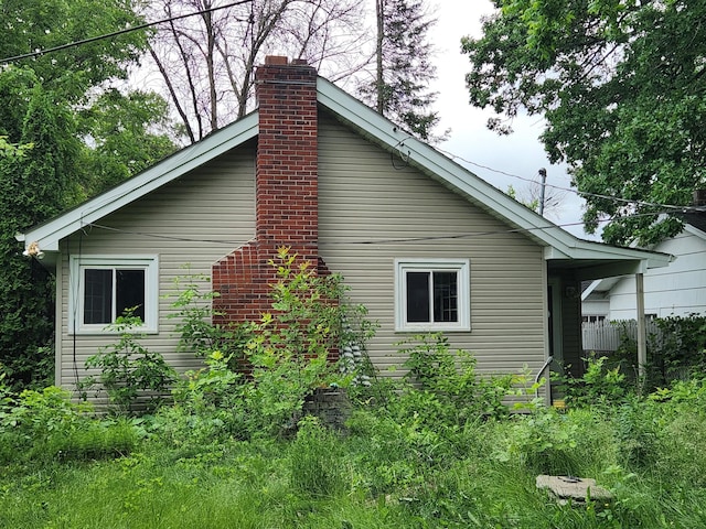 220 3rd Ave NW, Forest Lake, MN 55025 - view of home's exterior featuring a chimney